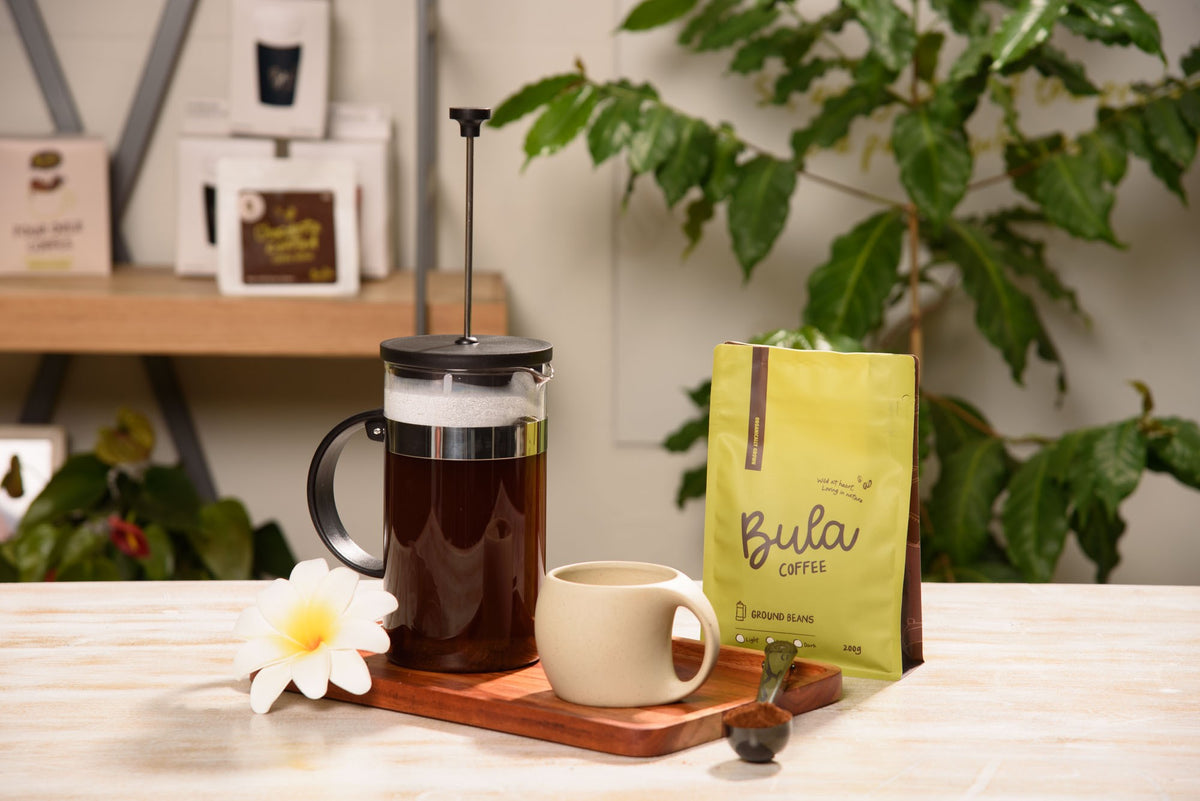 French press of Bula Coffee beside a 200g bag of ground beans